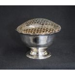 A George V silver rose bowl, of circular form having a Chippendale style rim with a filled centre,