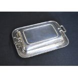 A George V silver serving dish, of rectangular form having egg and dart rims to the body and lid