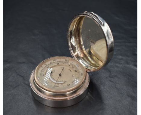An Edwardian silver cased pocket barometer, of circular plain form, marks for London 1909, maker Asprey &amp; Co Ltd, 6.5cm x