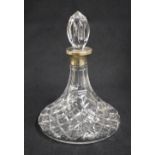 A late 20th century silver mounted cut glass decanter, of bulbous form having an elongated neck with