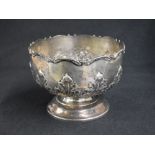An early George V silver rose bowl, of circular form having a lobed scroll rim with embossed