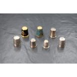 An assortment of seven silver thimbles of various size and design including two Charles Horner '