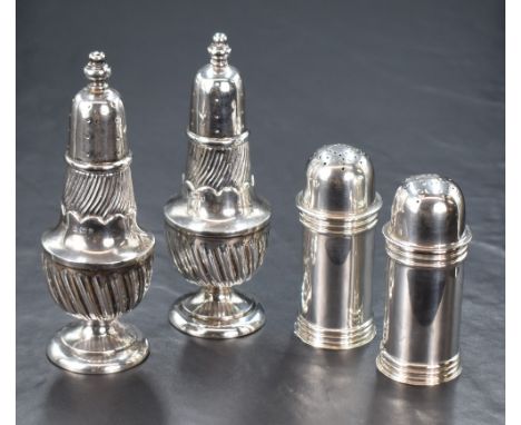 A pair of Victorian silver pepperettes, of cylindrical form having banding decoration, marks for London 1899, maker Horace Wo