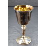 A cased Elizabeth II silver cup, of traditional form having a slightly flared rim, gilted interior