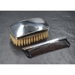 An Elizabeth II silver mounted gentleman's hair brush, of plain rectangular form, along with a