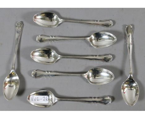 A set of six matching silver teaspoons assayed Sheffield 1940, along with a silver teaspoon with golf theme, assayed Sheffiel