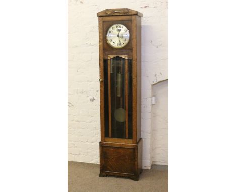 A 1930s Art Deco carved oak longcase clock with triple brass weights and Westminster chime (AF).