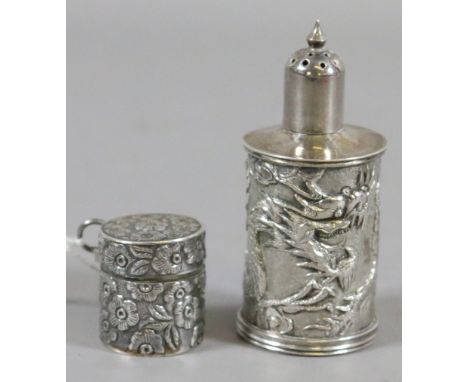 A Chinese solid silver pepperette with chased dragon and scrolling clouds along with a Sterling silver thimble case to contai