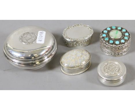 An Indian silver trinket box set with jade and turquoise along with four other eastern silver and plated boxes.