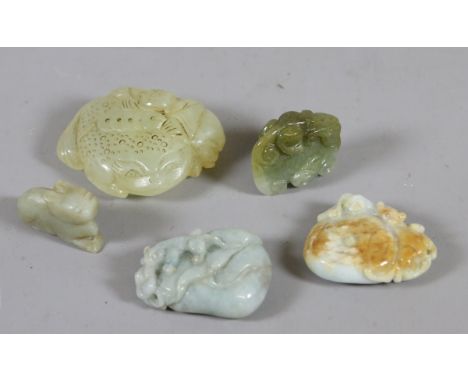 Four C20th Chinese carved jade boulders and a small figural carving.