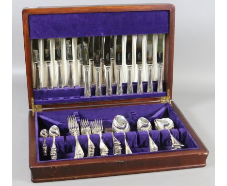 A mahogany cased part canteen of Sheffield silver plated cutlery with beaded threading.