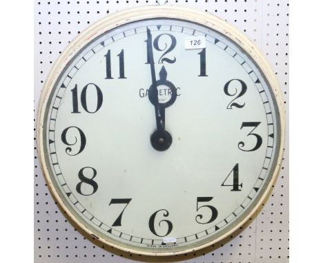 A vintage Garnetric large painted metal electric wall clock with painted dial having Arabic numerals and rail road minute tra
