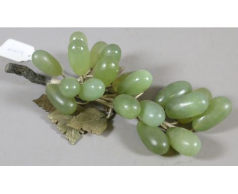 A jade coloured hardstone bunch of grapes.