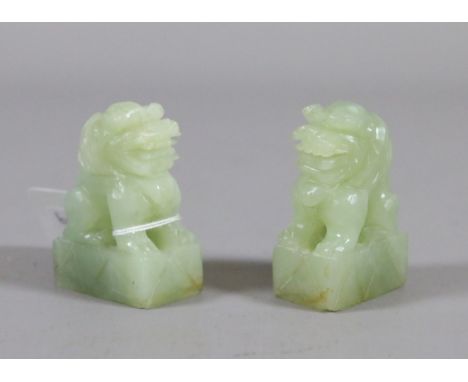 A pair of Chinese Celadon jade carved temple dogs.