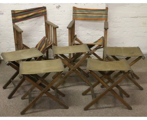 Four vintage folding stools with canvas seats and a pair of folding armchairs.