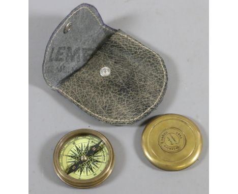 A brass pocket compass.