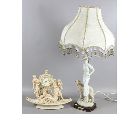 A figural tablelamp and shade along with a figural mantel clock.
