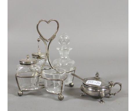 A silver framed four bottle cruet set assayed Birmingham 1900 along with a silver mustard pot with Bristol blue glass liner a