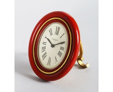 A CARTIER OF PARIS OVAL EASEL CLOCK, 3.5in x 2.25in. in a red Cartier bag No: 7507/15122 