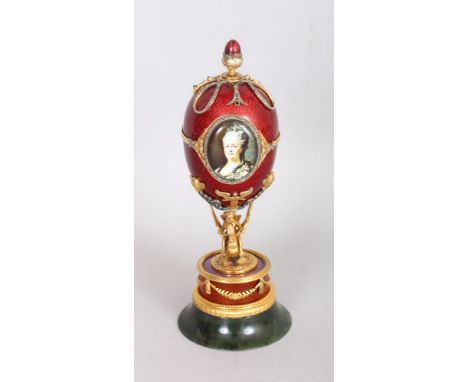 A VERY GOOD FABERGE MODEL SILVER GILT, DIAMOND AND GUILLOCHE ENAMEL EGG, with acorn finial, the egg with an enamel portrait b