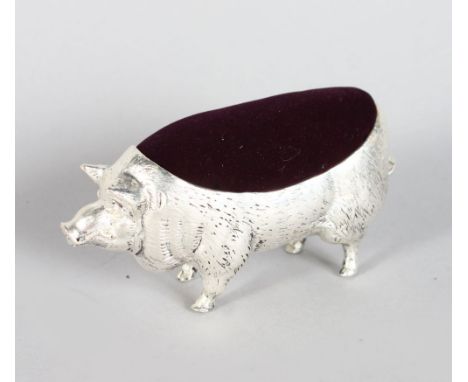 A LARGE PIG PIN CUSHION 4in long