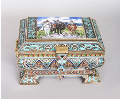 A GOOD RUSSIAN SILVER AND ENAMEL DECORATED CASKET, the hinged cover inlaid with a panel of figures on horseback. 6ins high.