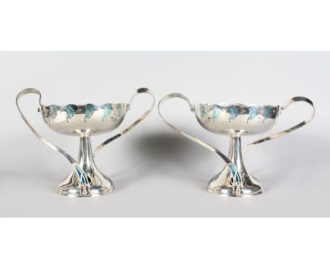 A PAIR OF SILVER PLATED ART NOUVEAU STYLE PIQUE ENAMEL TWO HANDLED TAZZA