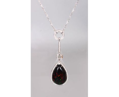 AN 18CT WHITE GOLD IMPRESSIVE PEAR SHAPED BLACK OPAL AND DIAMOND PENDANT NECKLACE of over 10CTS.