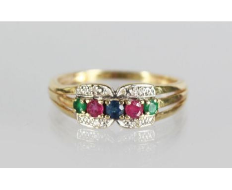 A 14ct GOLD RUBY AND DIAMOND THREE ROW RING