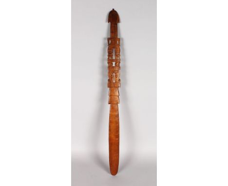 PAPUA NEW GUINEA (20TH CENTURY), A CARVED WOODEN LIME-SPATULA (BETEL SPOON) 28.5ins in length.