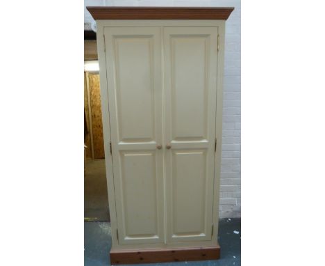 A cream painted wardrobe with two doors and rail inside under one shelf 60 x 106 x 191cmH