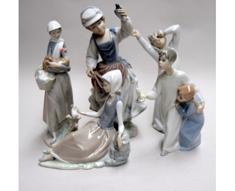 Four Lladro figures: Shepherdess with Dove (4660), Girl with Cockerel (4591), Boy in Night Shirt (4874), a girl holding a dov