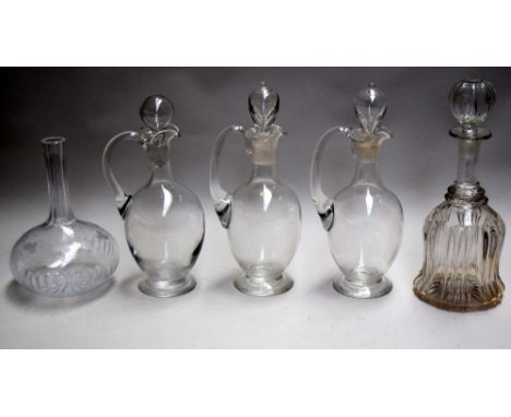 Three antique plain glass claret jugs, together with a cut glass decanter and an etched glass decanter