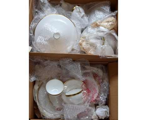 A substantial collection of ceramic ware, heightened in gilt on a cream/white ground, from makes including Royal Doulton 'Gol
