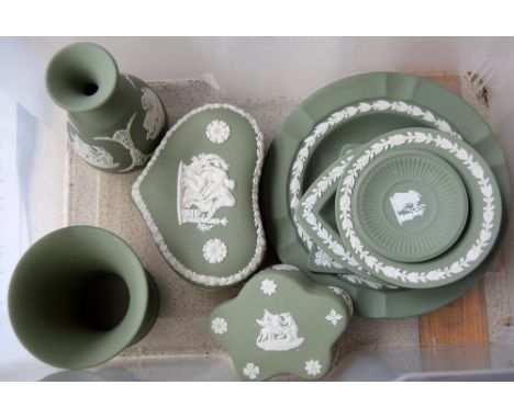 Nine pieces of Wedgewood olive jasperware, including two posy vases, a heart shaped trinket box, another trinket box, two tri