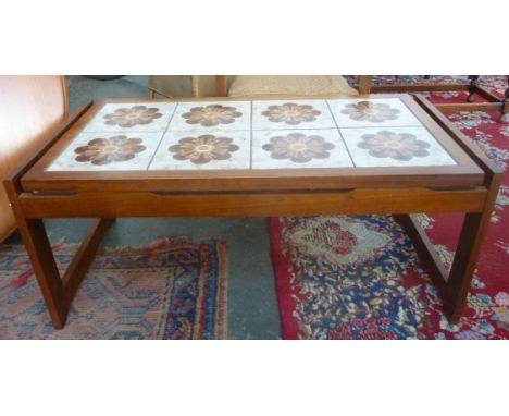 A 1960s coffee table with ceramic tiles to top