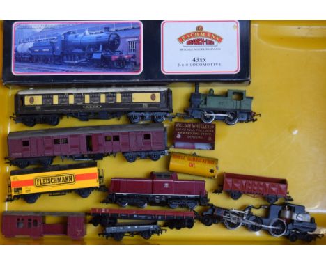 A collection of model railway parts, including a Bachmann GWR 43xx 2-6-0 in box, and parts from Tri-ang and Fleischmann