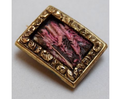A Victorian yellow metal mourning brooch, the hair panel formed into ears of wheat, inscribed on the reverse 'William Marsh, 