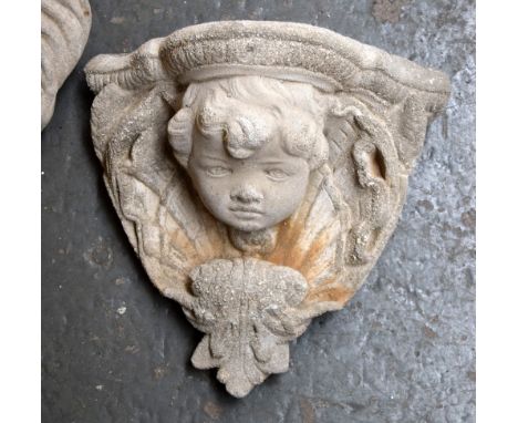 A wall mounted cherub's face planter, 23cmL