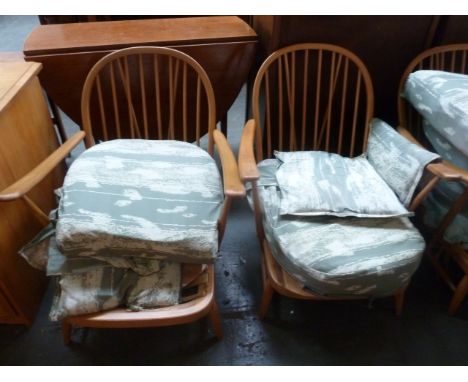 A pair of Ercol low reclining armchairs with removable cushions, 75cmH