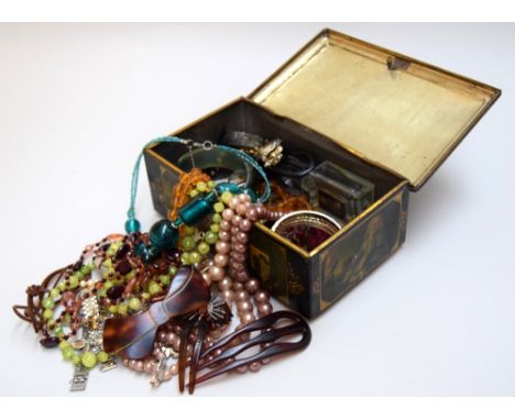 A collection of jewellery, including a number of costume jewellery necklaces and bracelets, hair combs and white and yellow m