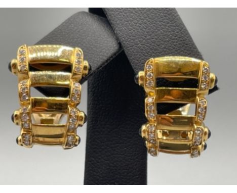 18ct gold Patek Philippe diamond set ornate earrings set with thirty round brilliant cut diamonds and three round blue stones