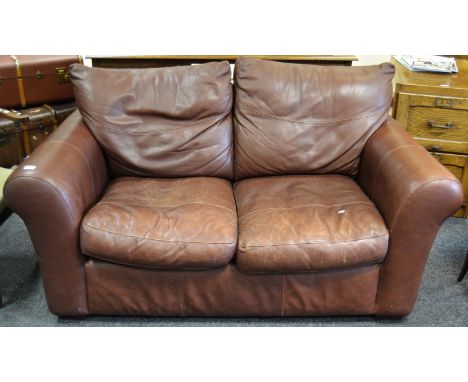 A contemporary two seater sofa upholstered in chocolate coloured leather 