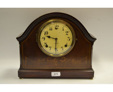 An early-20th century mahogany mantel clock manufactured by Gilbert, Conneticut, twin-train movement striking on a gong, Arab
