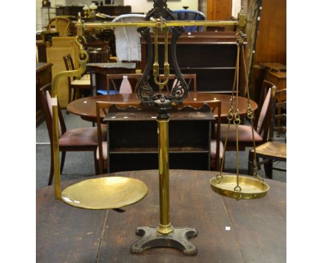 A W & T Avery brass and cast iron balance scales, the brass pans,  28cm and 19cm, marked