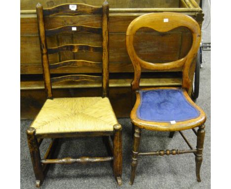 A North Country oak rush-seated, ladder back nursing rocker; a late-Victorian mahogany balloon-backed bedroom chair, celestia