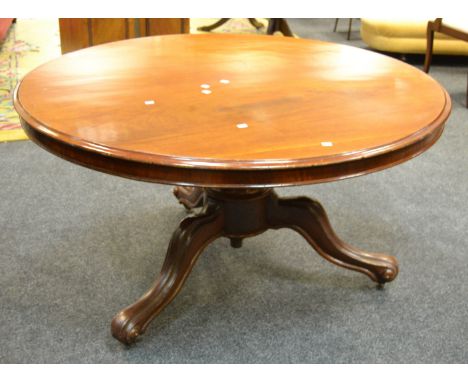 A Victorian mahogany breakfast table, turned supports, carved tripod base, casters