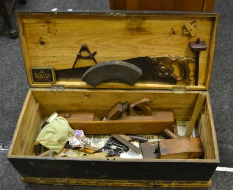 A late-19th century pine toolbox; tools, chisels, saw, planes