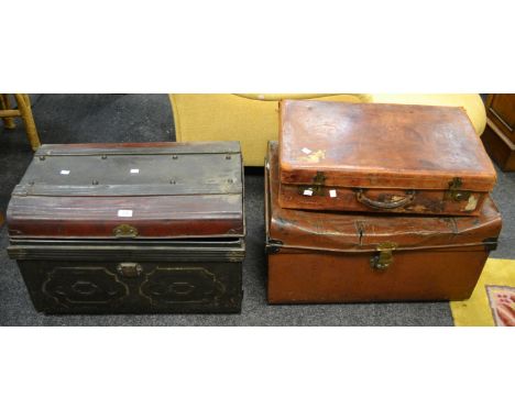 An early-20th century leather suitcase; a metal trunk; another (3)