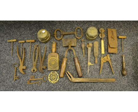 Tools - a 19th century hand-held wooden wedge, stamped 'Bashley'; a pair of Clark sheep shears, c.1920; cart hub caps; etc. (